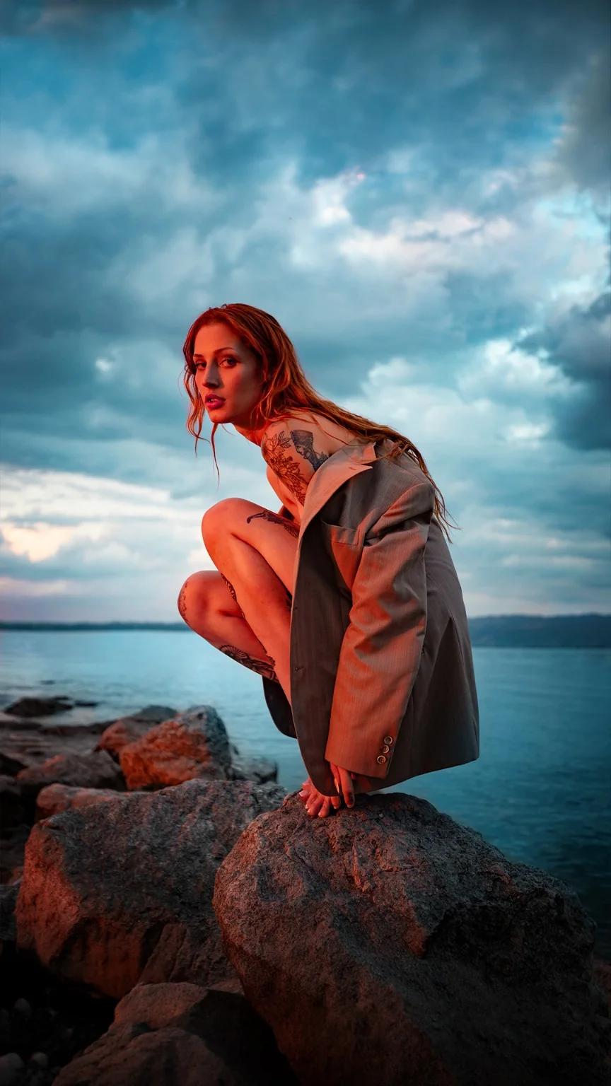 Color editorial portrait by the water